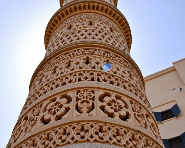 Close-up of Masjid Minar Stone Carvings with Golden Light