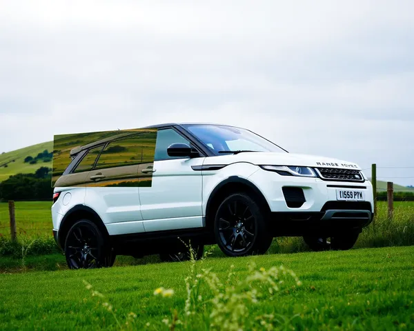 Connected Range Rover Evoque in Scenic Countryside with Rolling Green Hill Background