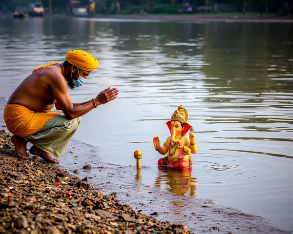 Devotee Performs Ritual at Riverbanks During Ganesh Visarjan