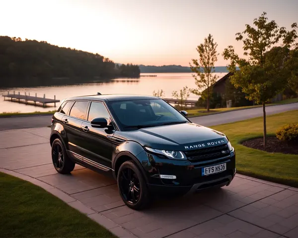 Luxurious Range Rover Evoque on Driveway with Serene Lake Sunset Background