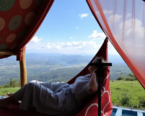 Person Relaxes in Eeco with Peaceful Landscape Background