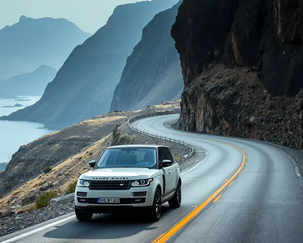 Range Rover Takes Winding Mountain Road with Cliffside View