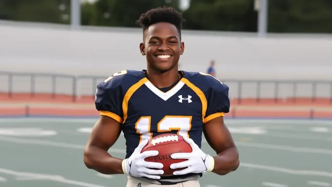 Rodney Hilton Jr. Poses with Football and Bright Smile