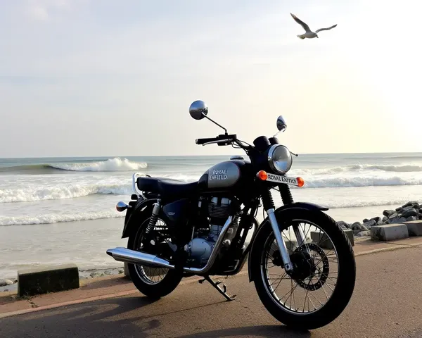 Royal Enfield Bike Parked on Beachside Road with Ocean View