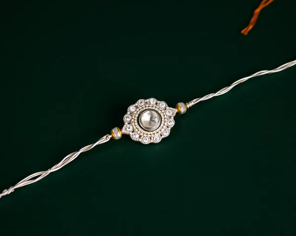 Shimmering Silver Thread and Gemstone on Dark Green Background Fancy Rakhi