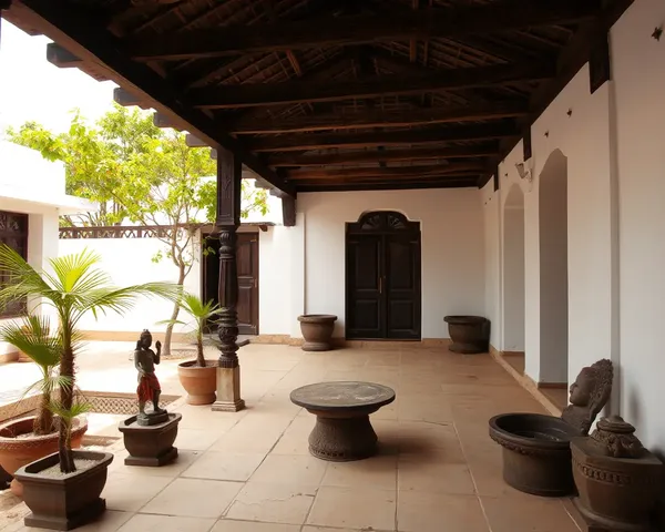 Traditional Indian Charpai in Courtyard with Plants and Statues