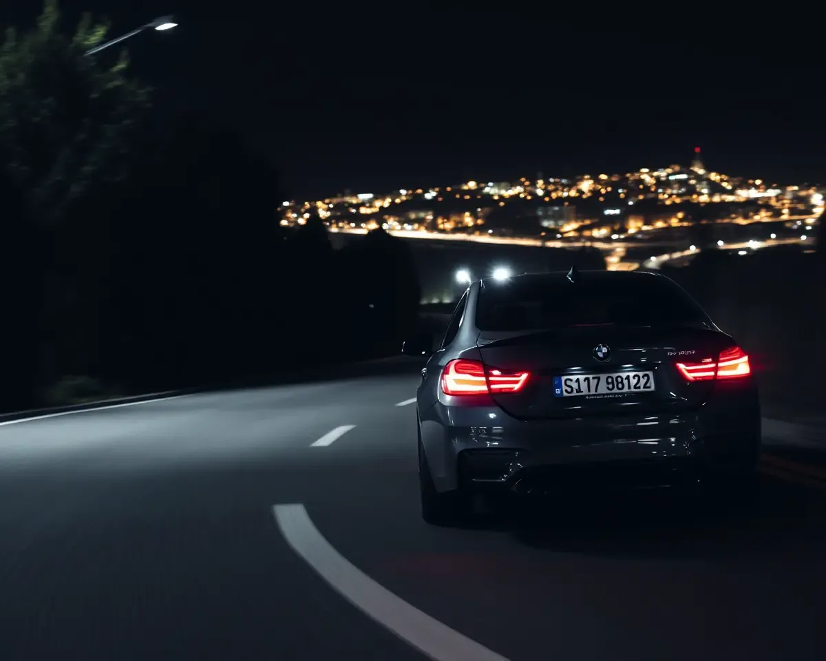 BMW M4 Racing Down Winding Road at Night