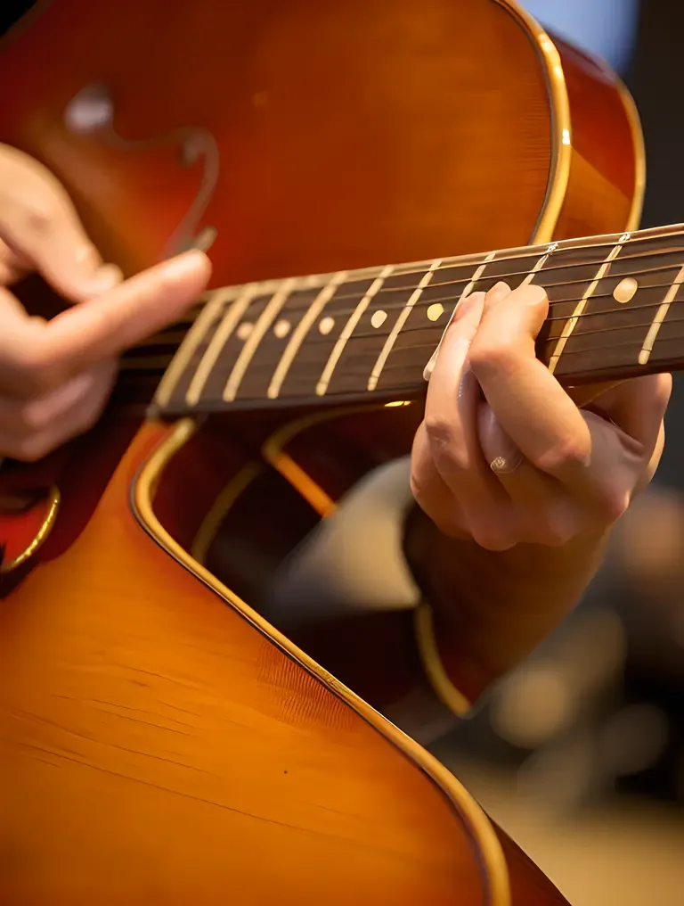 Buke Player's Fingers Dance Across Strings for Beautiful Melody