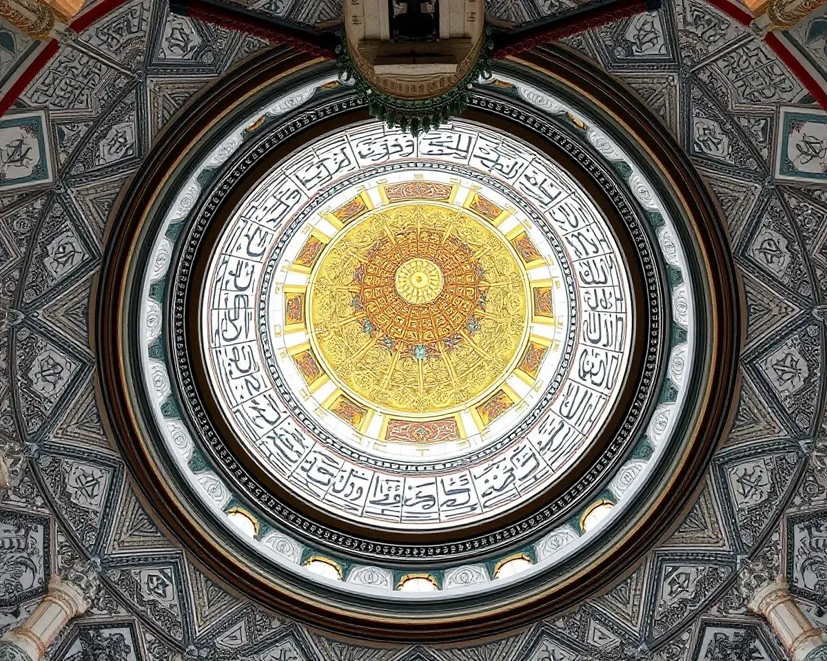 Ornate Masjid Minar Interior with Tilework and Calligraphy