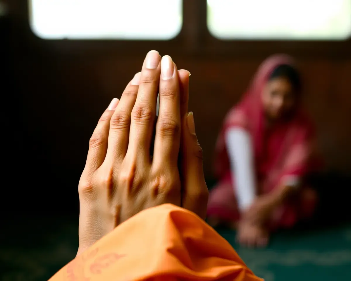 Praying Hands of Sad Punjabi Woman Fading Away